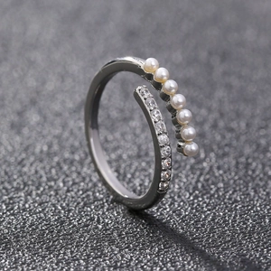 Silver open ring featuring elegant white pearls and sparkling cubic zirconia stones