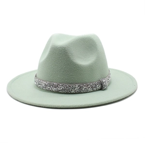 Mint green wool fedora hat with sparkling silver rhinestone band on white background