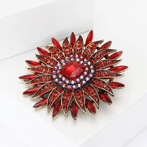 Elegant vintage sunflower brooch with red rhinestones and gold alloy metal base