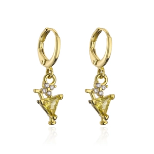 Macro view of 18K gold cocktail glass earrings featuring yellow triangle zircons