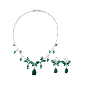 Vintage palace style jewelry set with emerald green teardrop pendants and butterfly design
