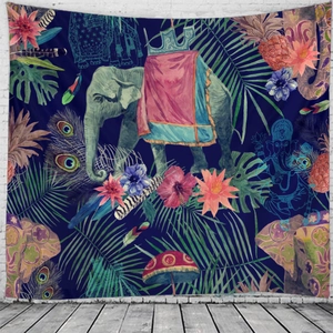 Detail of bohemian tapestry featuring elephant and peacock feathers on white wall