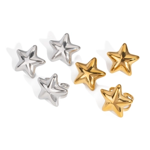 Set of six minimalist star rings in gold and silver finish on white background