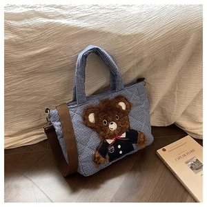 Quilted blue checkered kids tote bag featuring a 3D plush bear and brown canvas strap