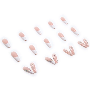 Faux ongles French rose et blanc avec art floral et strass de forme cercueil longue