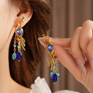 Vintage gold peacock drop earrings with blue gemstones and colorful beaded tassels