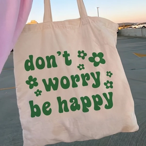 Sac fourre-tout rétro en toile crème avec imprimé fleurs vertes et texte inspirant