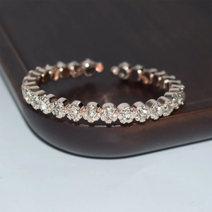 Macro view of rose gold adjustable bracelet with sparkling row of white crystals