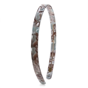 Macro detail of tortoiseshell acetate headband with internal metal wire reinforcement