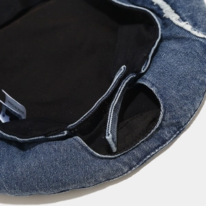 Deep blue denim beret with interior lining and adjustable velcro strap for size