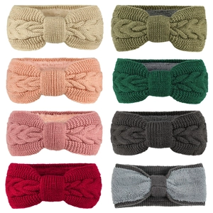 Detailed grid of knitted winter headbands showing thick cable stitch texture and warm lining