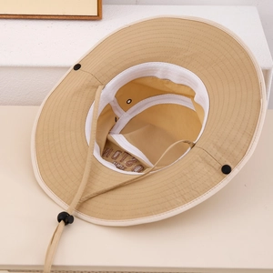 Detail view of khaki bucket hat interior with BOSTON embroidery and adjustable wind cord