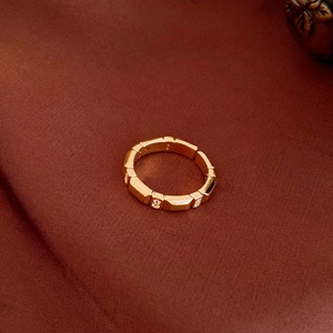 Detailed macro shot of 18K gold plated geometric ring with crystal diamond embellishments