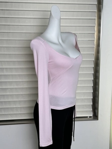 Side view of pink slim fit long sleeve T-shirt with deep U-neck on a female mannequin