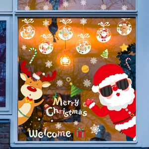 Festive Christmas window decals featuring Santa, reindeer and snowflakes for holiday decor