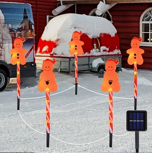 Solar gingerbread man garden stakes with warm LED lights for Christmas outdoor pathway decor