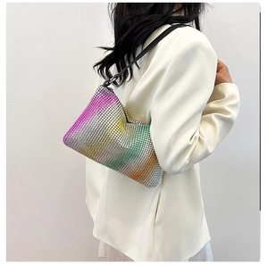 Detail of colorful gradient rhinestones and black leather strap on underarm bag