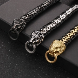 Detailed view of punk lion head bracelets in gold, bright silver, and antique silver finishes
