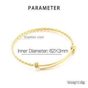 Detailed view of golden twisted stainless steel bracelet with 62x3mm inner diameter size