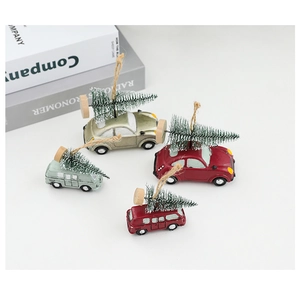 Detail of resin vintage car Christmas tree ornaments in red and green with hemp rope
