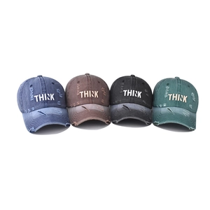 Vintage washed baseball cap with TARK embroidery and distressed details in four colors