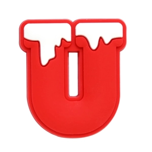 Macro shot of red and white PVC letter U shoe charm accessory for clog decoration