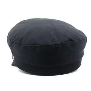 Chic black baker boy hat with a metal chain detail and smooth fabric texture for women