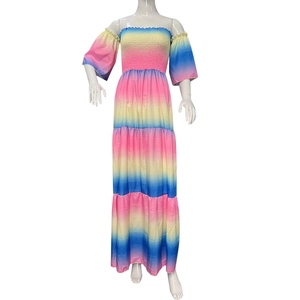 Detail of off-shoulder rainbow gradient maxi dress with smocked bodice and puff sleeves