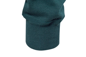 Close-up of high-quality dark green ribbed cuffs on a men's knitted cardigan sweater
