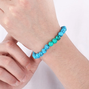 Close-up of turquoise beaded bracelet showing natural stone texture on wrist