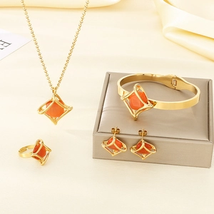 Detailed set of geometric rhombus jewelry with orange stones in high-quality gold plating