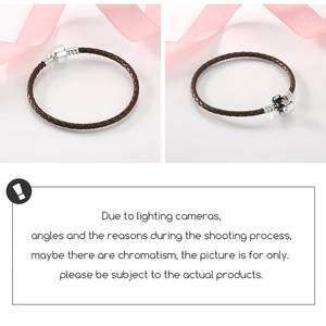 Detail of dark brown braided leather bracelet featuring a silver cylinder clasp on white background