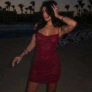 Close-up of deep red bodycon mini dress featuring unique 3D teardrop texture and backless design