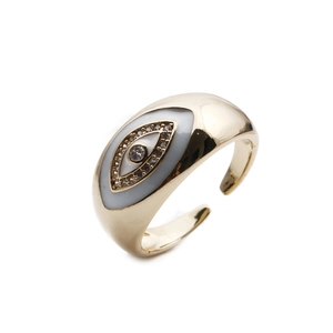 Detail of gold evil eye ring with white enamel and micro-set zirconia accents