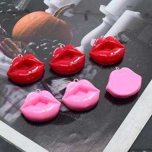 Polished red and pink resin lip charms for DIY jewelry making and fashion accessories