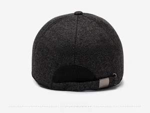 Rear view of winter baseball cap with textured tweed fabric and adjustable metal buckle