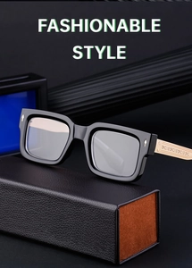 Detail of black square frames with engraved gold metal temples on a leather case