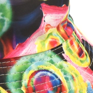 Macro shot of tie-dye bucket hat brim with precise five-row reinforced white stitching