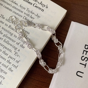 Handcrafted S925 sterling silver braided chain bracelet with oval links on vintage background