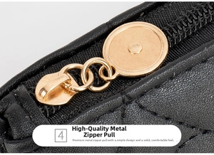 Detail view of premium gold round zipper hardware on a black quilted leather crossbody bag