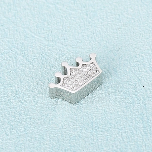 Polished silver crown jewelry pendant encrusted with sparkling clear zircon stones