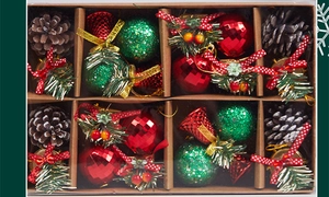 Close-up of Christmas box with pine cones, red glitter balls, and ribbon bells
