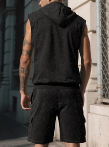 Detail of acid-wash hooded sleeveless vest and cargo shorts in casual street style