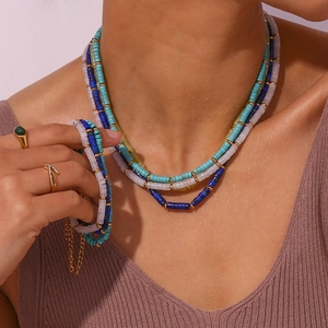 Bohemian multilayered beaded jewelry set with blue natural stones and gold metal accents