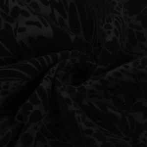 Close-up of black velvet burnout mesh fabric texture with elegant floral flocking