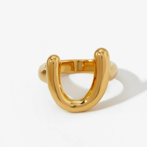 Minimalist U-shaped 316 stainless steel ring with polished golden finish on white background