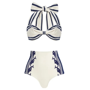 Retro two-piece halter bikini set with navy stripes and bow detail on a white base