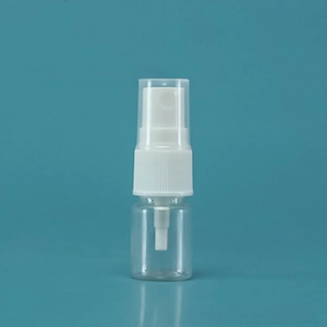 Close-up of portable clear plastic spray bottle with white fine mist atomizer and cap