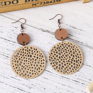 Vintage bohemian geometric disc earrings with dark brown wood and beige hollow circular pattern