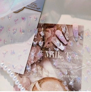 Detail of vintage laser nail art stickers featuring butterfly and floral patterns